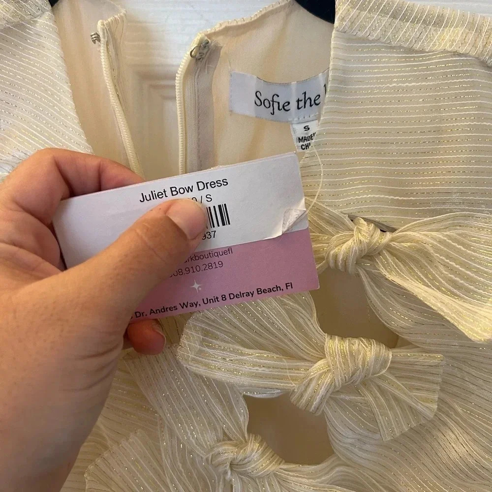 Gold bow front mini dress. Sofie the Label - Picture 6 of 6